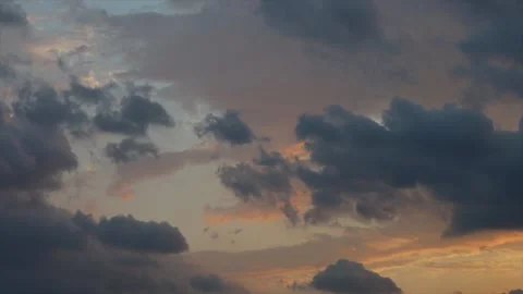 Beautiful sunset sky with clouds, birds soar in the air. Dramatic clouds floa Stock Footage 163677486