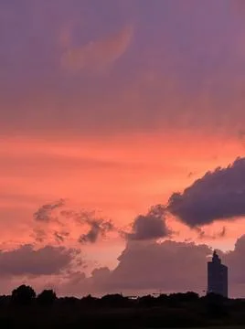 Beautiful sunset sky with clouds over city skyline Stock Photos