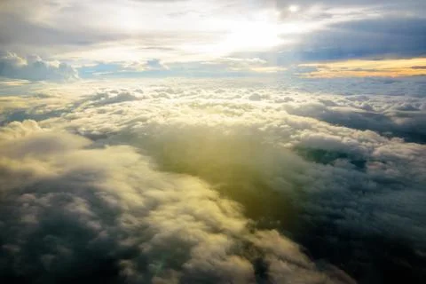 Beautiful sunset sky clouds  seeing through the airplane windows. Stock Photos