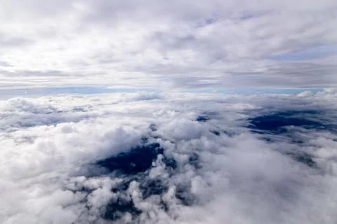 Beautiful sunset sky clouds  seeing through the airplane windows. Stock Photos