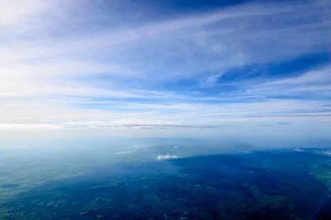 Beautiful sunset sky clouds  seeing through the airplane windows. Stock Photos