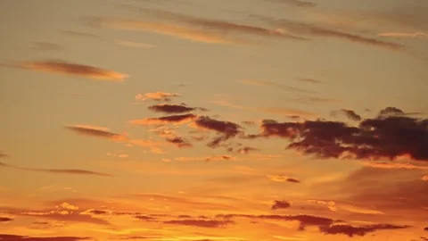 Beautiful sunset sky with dreamy clouds, offering a tranquil and romantic vibe. Stock Footage 299855278