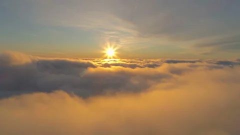 Beautiful sunset in the sky. Flight under cloudscape. Traveling by air. Stock Footage 125617473
