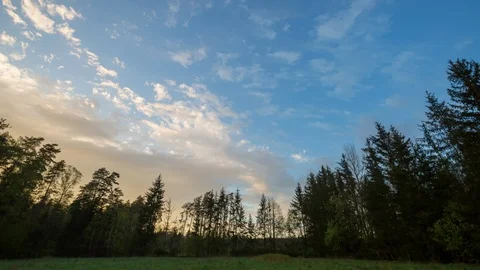 Beautiful sunset sky over spring meadow and forest in Poland. Stock Footage 91599028