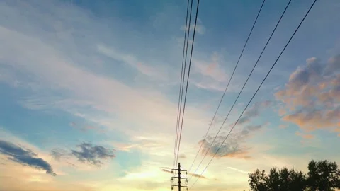 Beautiful sunset sky with power lines in rural location 스톡 동영상 303801449