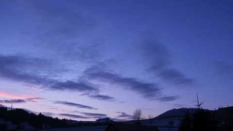 Beautiful sunset sky with purple clouds, a house, and natural landscape Stock Footage 264043090