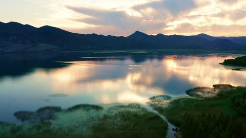 Beautiful sunset sky reflected in Lake Skadar in Montenegro. Stock Footage 134890150