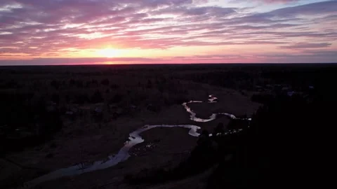 Beautiful sunset sky in the reflection of a winding river. Fantastic sunset. Stock Footage 196517244