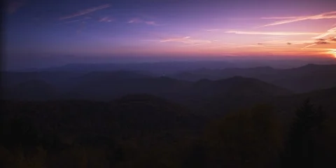 Beautiful sunset sky with setting sun and mountain ranges Video stock 103397983