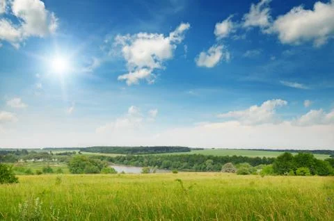 Beautiful sunset on spring field 스톡 사진