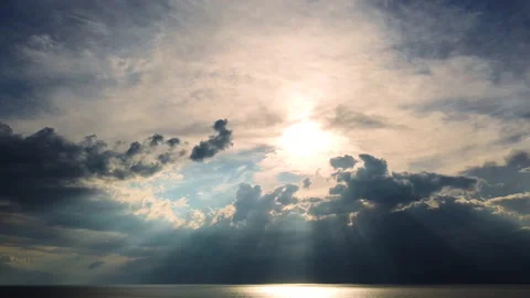 Beautiful sunset of the sun behind the clouds above the open sea. Aerial view Stock-Footage 157020077