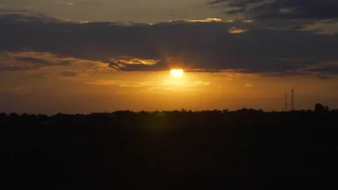 Beautiful sunset with sun behind the clouds Video stock 232621774