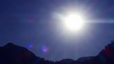 Beautiful sunset with sun light ray n spectrum bokeh lens flare over mountain Stock Footage 149393501