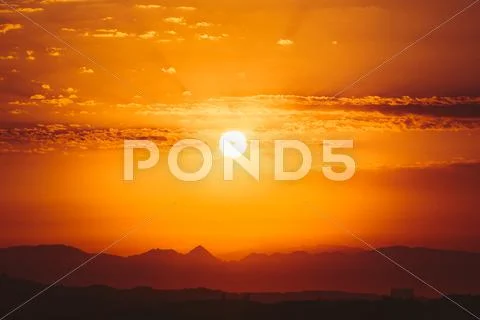 Beautiful Sunset Sunrise Over Dark Mountain Silhouette. Sunshine Stock Photos