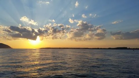 Beautiful sunset sunset on a river with clouds Stock Photos