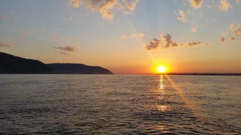 Beautiful sunset sunset on a river with clouds Stock Photos