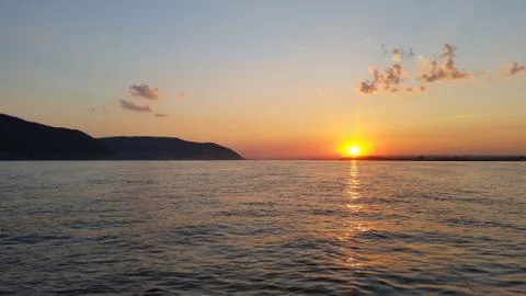 Beautiful sunset sunset on a river with clouds Stock Photos