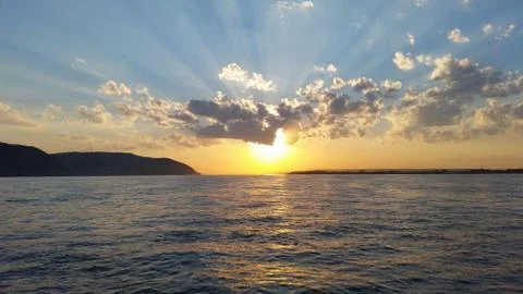 Beautiful sunset sunset on a river with clouds Stock Photos