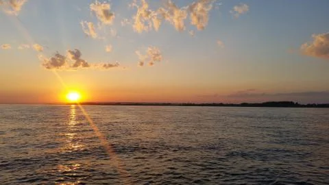 Beautiful sunset sunset on a river with clouds Stock Photos