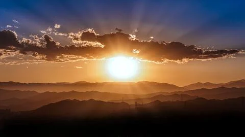 Beautiful Sunset surrounded by clouds Stock Photos
