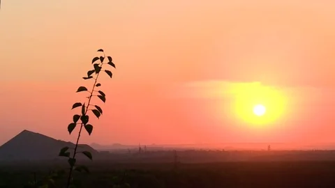 Beautiful sunset through the many layers of clouds. Sunset over the mountains Stock Footage 76602099