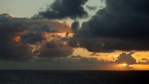 Beautiful sunset through stunning clouds over a calm sea. Stock Footage 88438177