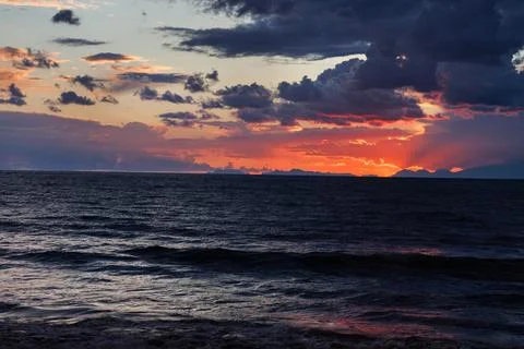 Beautiful sunset with thunderclouds over the Mediterranean sea of Turkey. Fotos Stock
