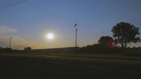 Beautiful sunset time laps as a train passes. Stock Footage 157996441