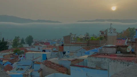 Beautiful sunset time lapse above African blue city Chefchaouen in Morocco Stock Footage 76719682