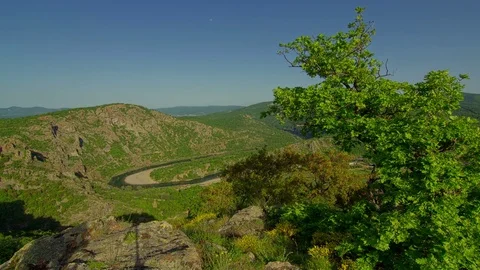 Beautiful sunset time lapse above rocky mountain, moving shadows in the valley Video stock 81498564