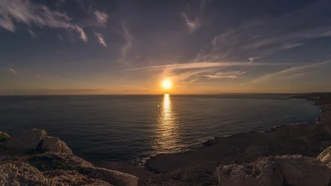 Beautiful sunset time lapse over the sea with clouds Stock Footage 128841933