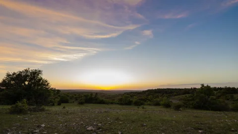 Beautiful sunset time lapse overlooking the hills in the Texas Hill Country Stock Footage 273472995
