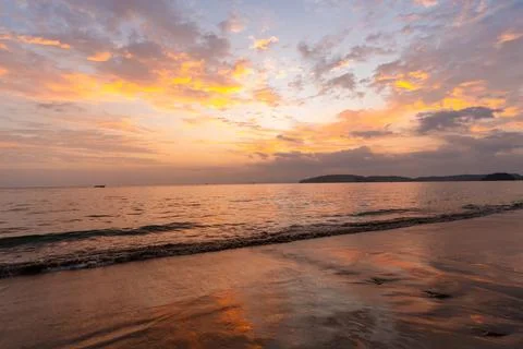 Beautiful Sunset on the tranquil beach background, Relaxing on summer vacation Stock Photos