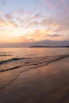 Beautiful Sunset on the tranquil beach background Stock Photos