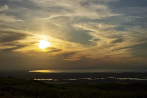 Beautiful sunset view behind the clouds Stock Photos