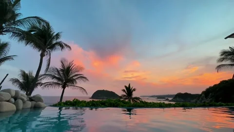 Beautiful sunset view from an infinity pool in Huatulco, Mexico tropical nature Stock Footage 329023986