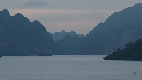 Beautiful sunset view of mountain and lake inside Ratchapprapha Dam. Stock Footage 104038168