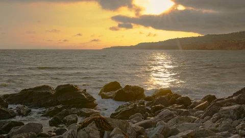 Beautiful sunset view of the ocean coast without people in the summertime . Stock Footage