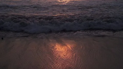 Beautiful sunset view of ocean waves. Handheld view of waves.  Stock Footage 151179159