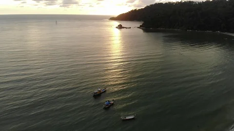 Beautiful sunset view over the beach. Reverse drone view Stock Footage 103209682