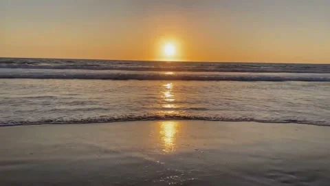 Beautiful sunset view over the beach by the sea Stock Footage 136842566
