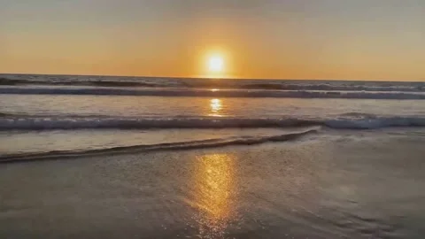Beautiful sunset view over the beach by the sea Stock Footage 136842589