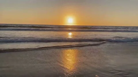 Beautiful sunset view over the beach by the sea Stock Footage 136842616