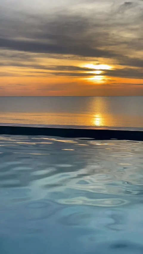 Beautiful sunset view from the pool in Andaman Sea, Thailand. 動画素材 277633037