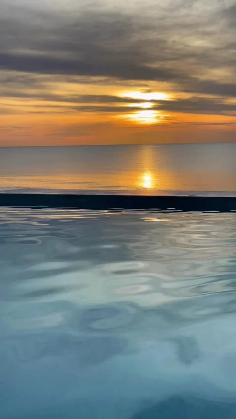 Beautiful sunset view from the pool in Andaman Sea, Thailand. 動画素材 277633635