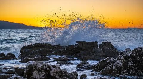 Beautiful sunset wave vibrant translucent color nice clear water splashes w.. Stock Photos