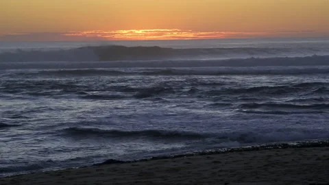 Beautiful sunset with waves rolling in Stock Footage 205117295