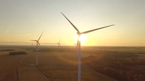 Beautiful sunset with windmill in a front.sun flare Stock Footage 114583462