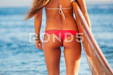 Beautiful surfer girl in sexy bikini Stock Photos