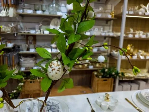 Beautiful table decorations for the Easter holiday. The branch of the green tree Stock Photos